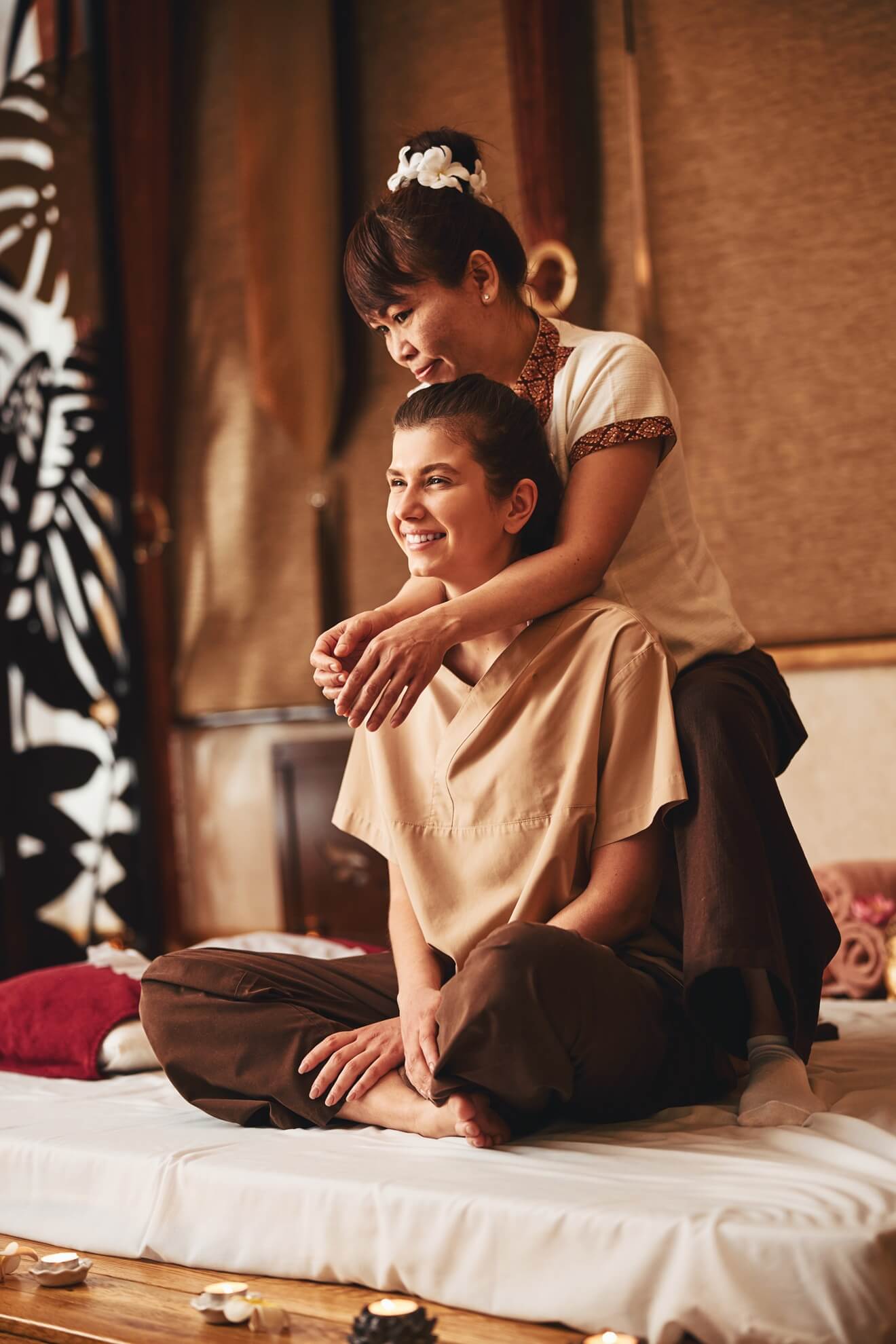Woman receiving thai massage